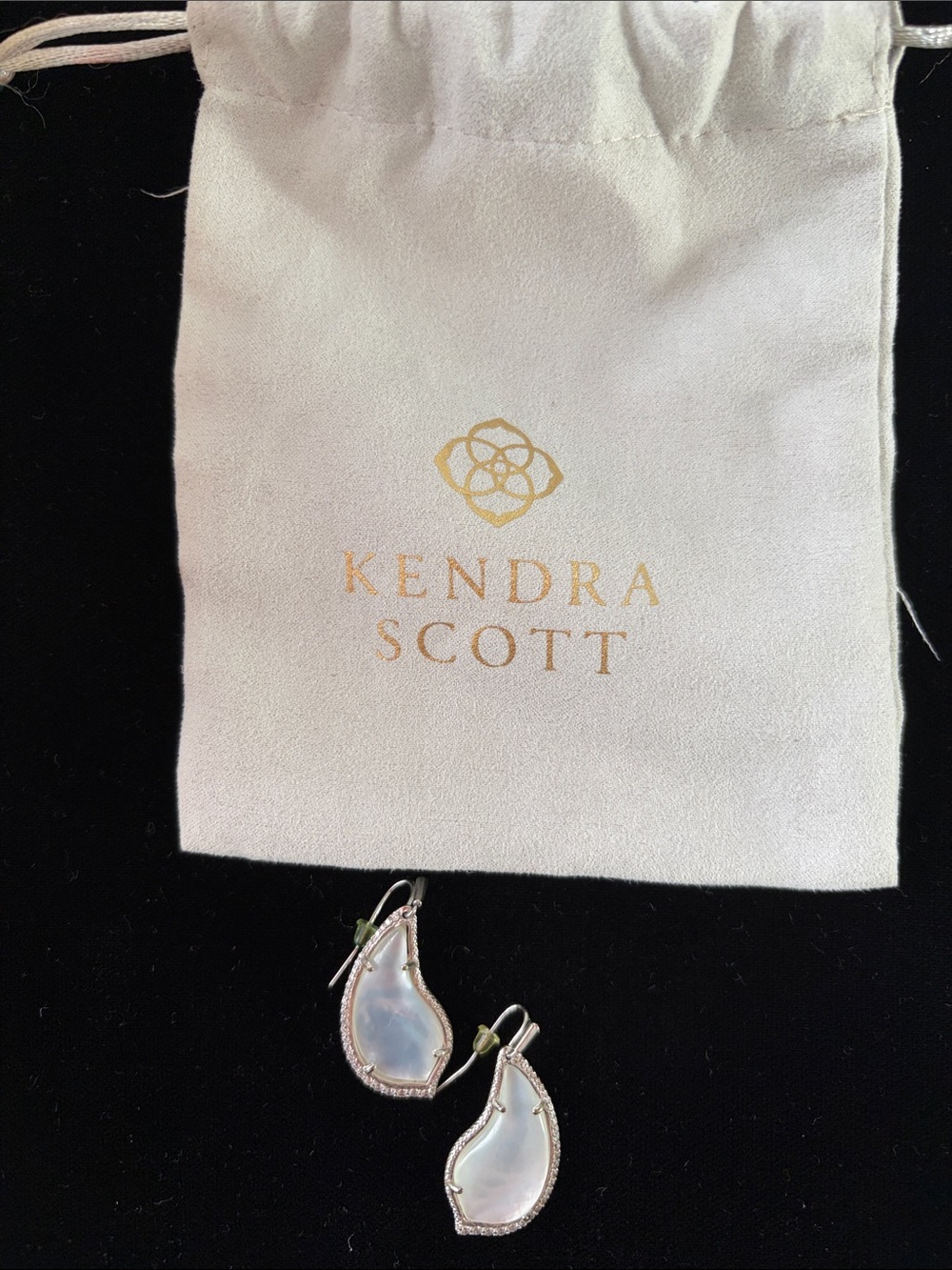 Kendra Scott white mother of Pearl Teardrop Dangle Earrings with silver finish.